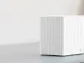 En vit, ribbad router som visar hur fungerar wifi.