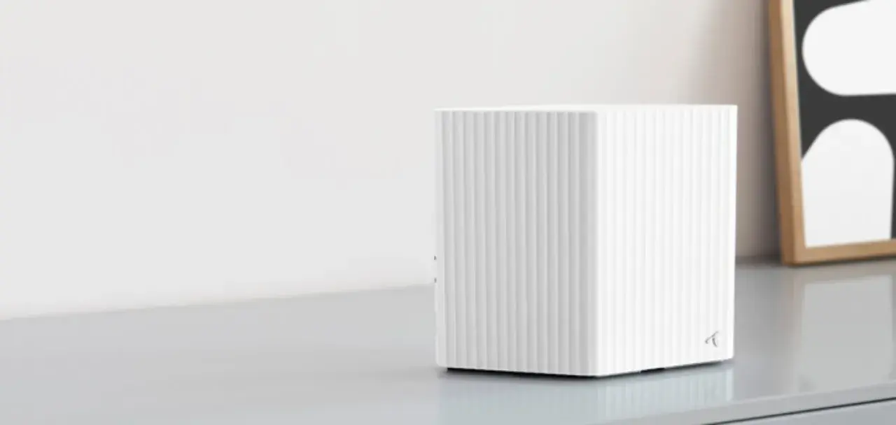 En vit, ribbad router som visar hur fungerar wifi.