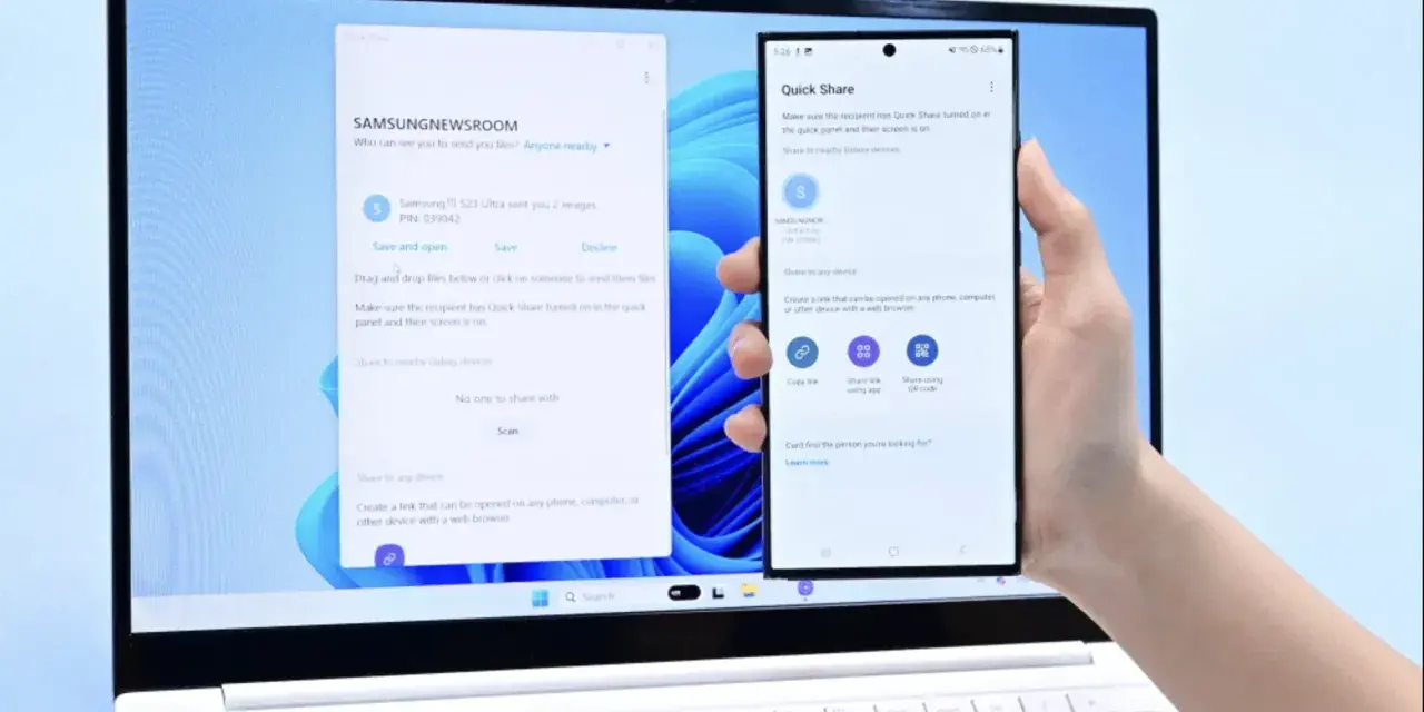 En hand håller en Samsung-telefon framför en laptop. Laptopen visar ett fönster för filöverföring, vilket underlättar att byta från iPhone till Samsung.